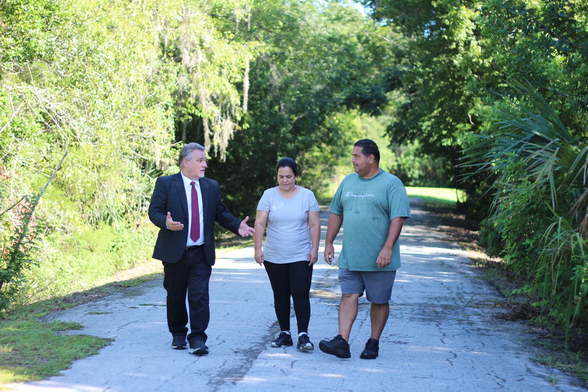 Robert Prater walking and talking with neighbors in District 37