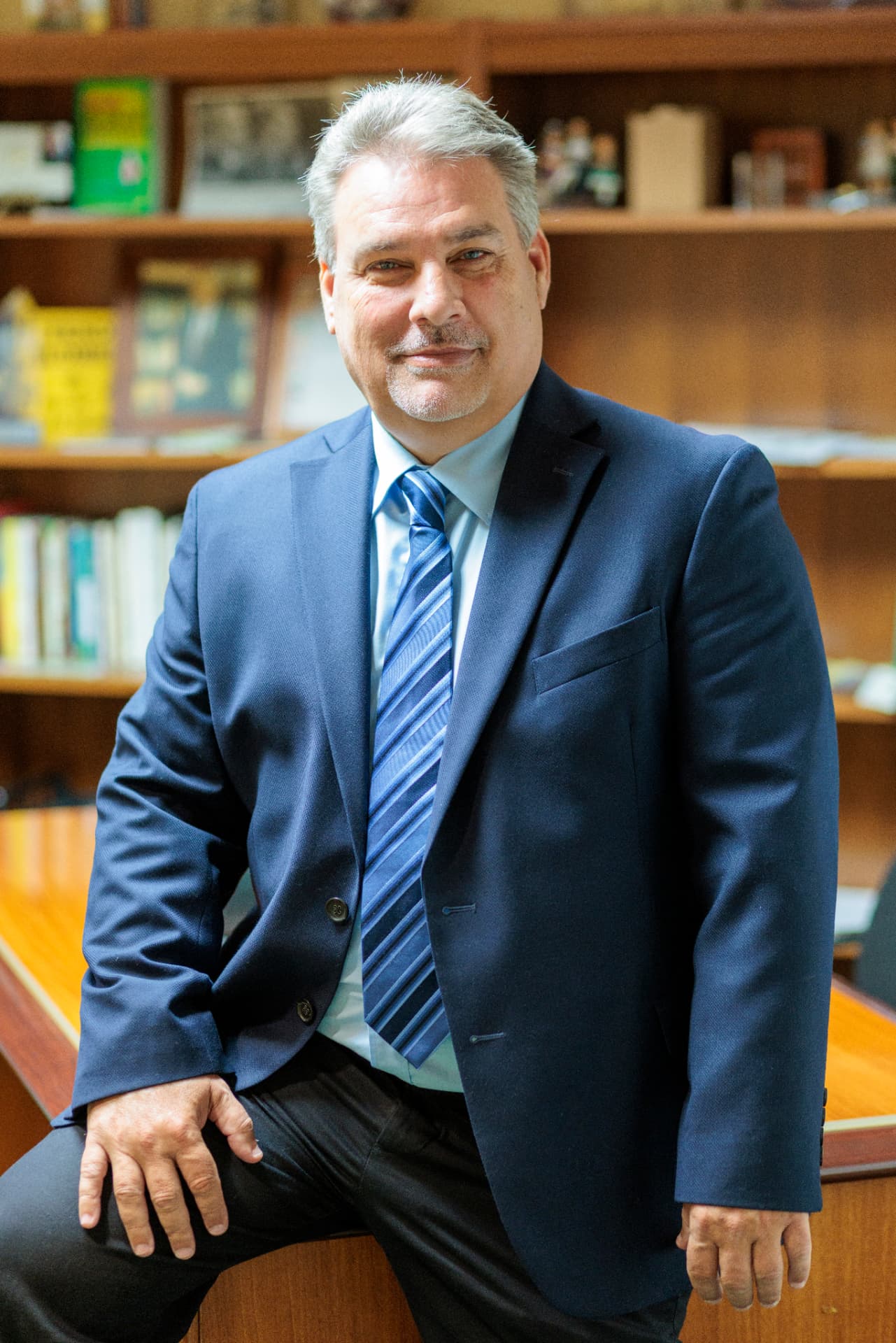 Robert Prater seated at a classroom desk